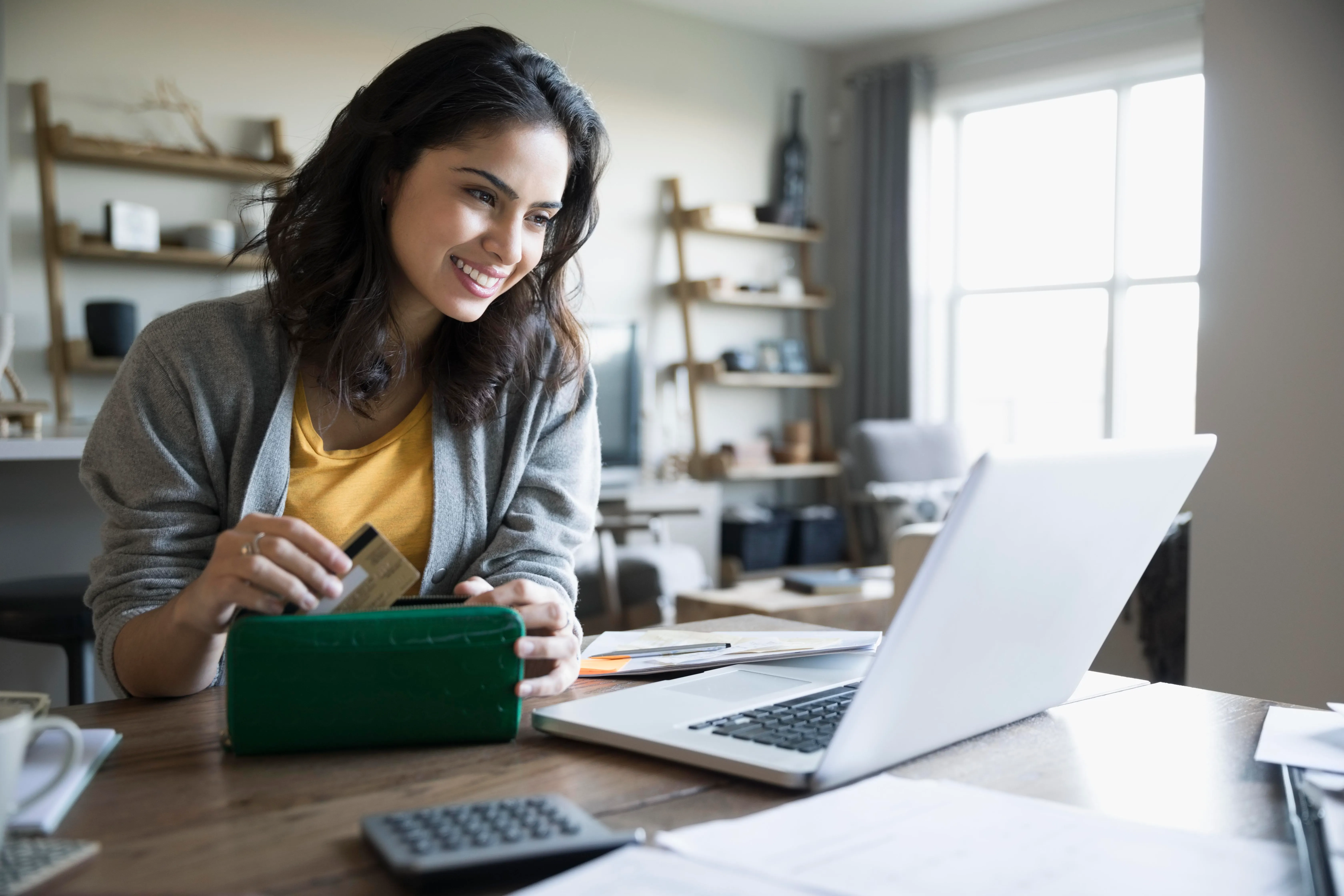 Homebuyer applying for a mortgage online from home
